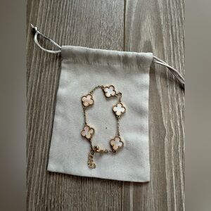 Elegant Gold and Pearl Clover Bracelet